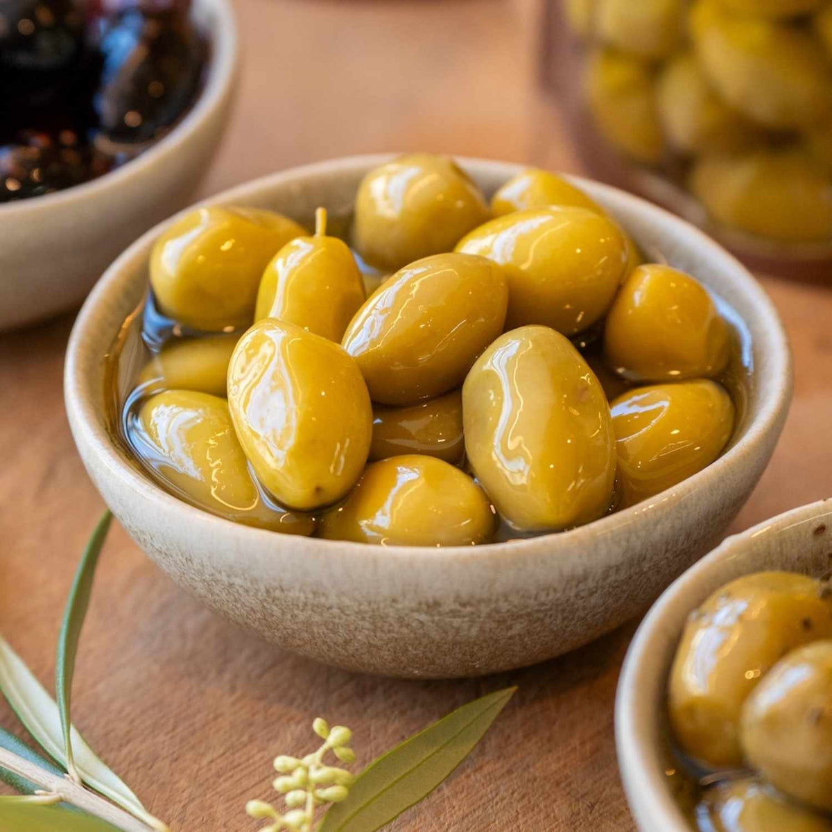 Four Flavours of Artisan Olives: Manuka Smoked, Sichuan Chilli, Truffle Oil, and Lemon Myrtle & Kawakawa