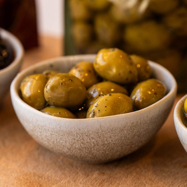 Four Flavours of Artisan Olives: Manuka Smoked, Sichuan Chilli, Truffle Oil, and Lemon Myrtle & Kawakawa