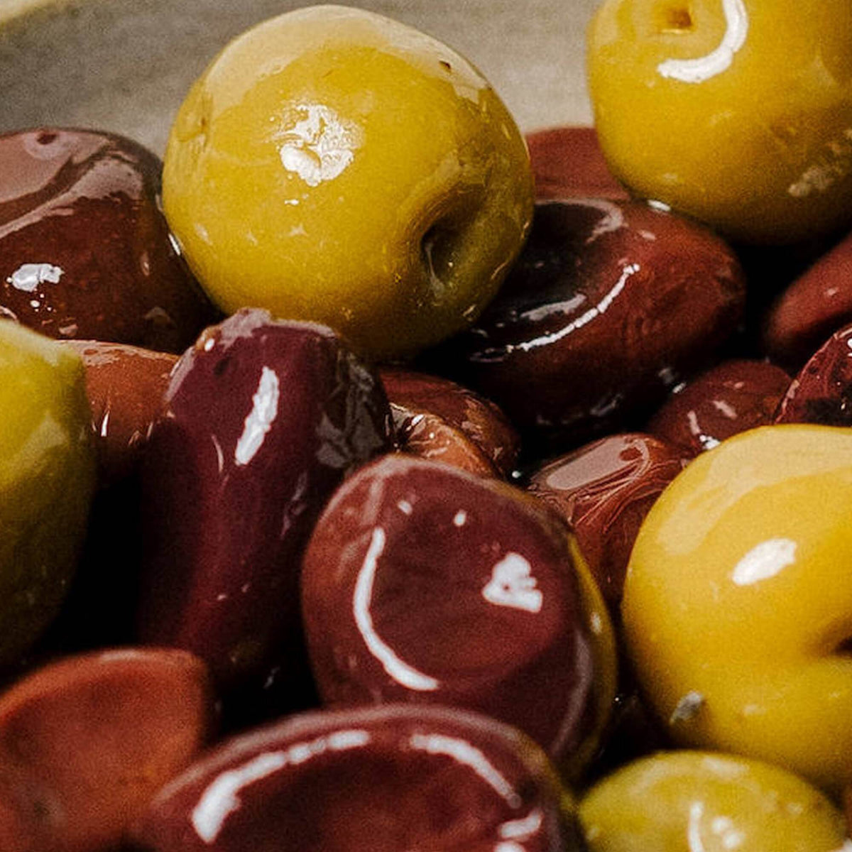 Close-up of marinated olives with a focus on texture and color.