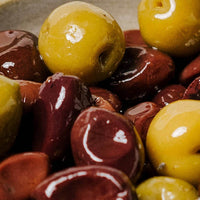 Close-up of marinated olives with a focus on texture and color.