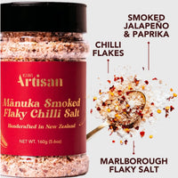 Jar of Manuka Smoked Flaky Chilli Salt with branding and product details on a white background